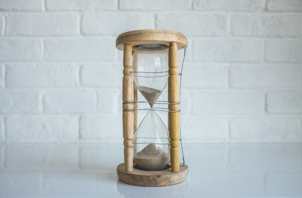 hourglass with sand flowing through